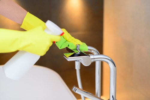 Technician cleaning oven racks and interior components