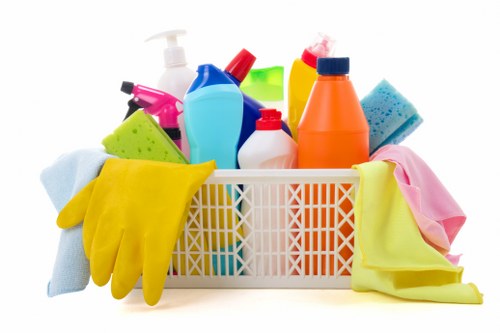 Oven cleaning technician preparing a kitchen work area