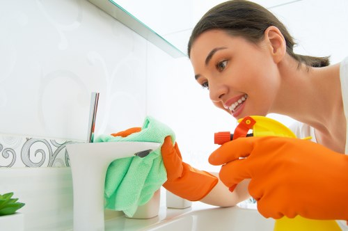 A local cleaning team maintaining desks and floors in a Merton office